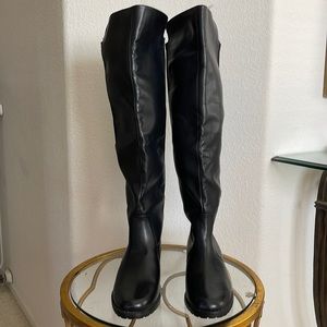 Tall black bonded leather with man-made materials riding boot style